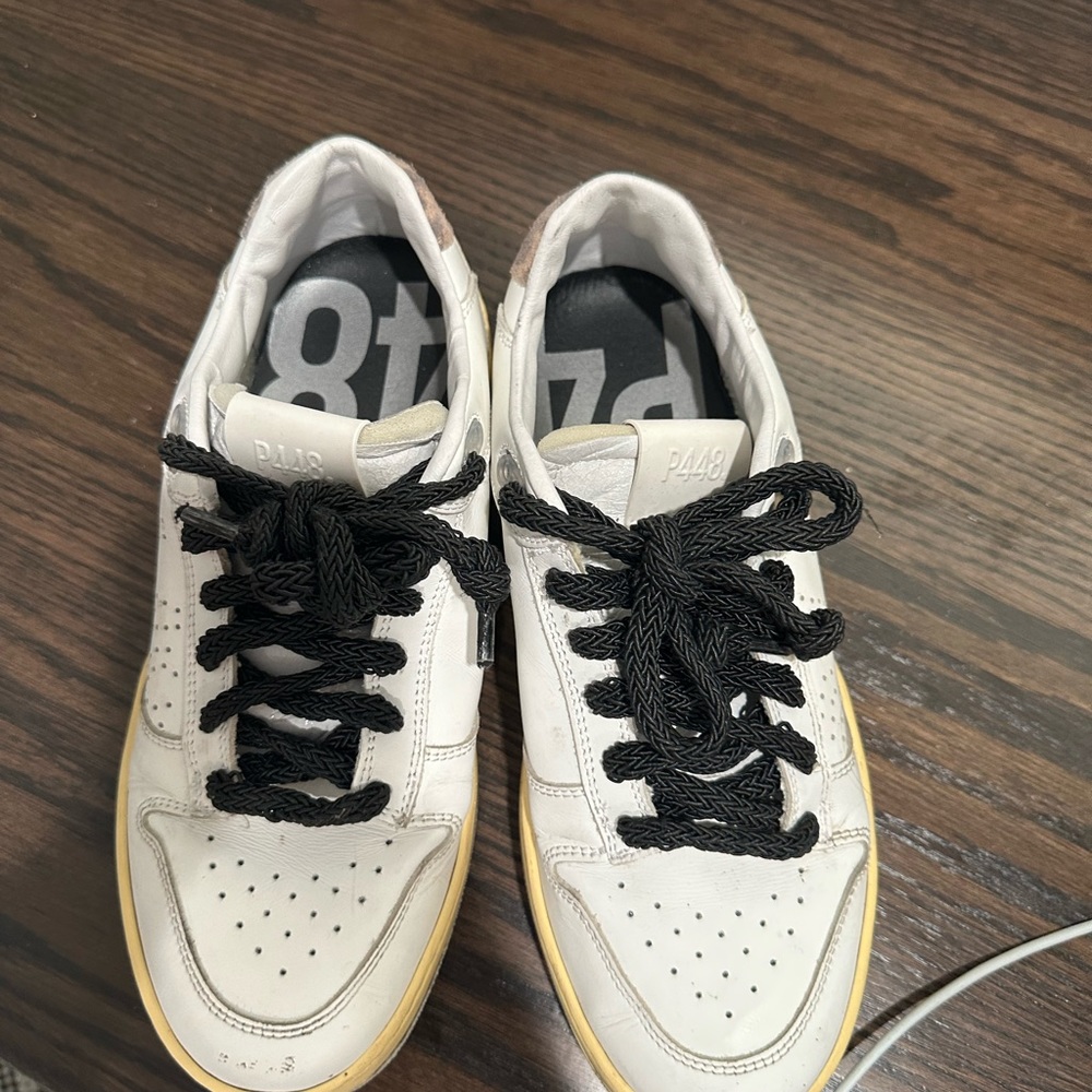 P448. Size 38, woman’s. Worn but in fair condition.